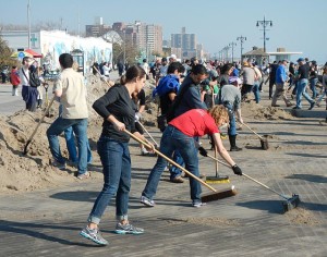 Volunteers clean up the Brooklyn boardwalk after Hurricane Sandy in 2012. Photo by Wikipedia